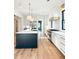 Bright kitchen features hardwood floors, a large island, and stainless steel appliances at 3845 Delinger Dr, Mount Pleasant, SC 29466