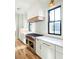 Modern kitchen featuring white cabinets, stainless steel appliances, and hardwood floors at 3845 Delinger Dr, Mount Pleasant, SC 29466