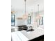 Spacious kitchen with stainless steel stove, large white quartz island, and modern lighting at 3845 Delinger Dr, Mount Pleasant, SC 29466