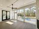 Screened porch with fireplace overlooking a pool; offering a serene outdoor retreat at 3845 Delinger Dr, Mount Pleasant, SC 29466