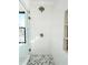 Shower featuring neutral herringbone tile flooring, glass door and built in shelves at 3845 Delinger Dr, Mount Pleasant, SC 29466