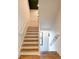 Wooden staircase with white railings and trim, leading to upper or lower levels of the home at 3845 Delinger Dr, Mount Pleasant, SC 29466