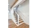 Modern staircase with hardwood steps and black metal railing at 3845 Delinger Dr, Mount Pleasant, SC 29466