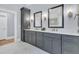 This bathroom features gray cabinets, double vanity, and marble floors at 3851 Sawyers Island Dr, Mount Pleasant, SC 29466