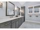 This bathroom features gray cabinets, double vanity, and marble floors at 3851 Sawyers Island Dr, Mount Pleasant, SC 29466