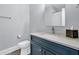 Bathroom with dark cabinets, a light countertop, a toilet, and a shower-tub combo at 3851 Sawyers Island Dr, Mount Pleasant, SC 29466