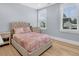 Cozy bedroom with hardwood floors, with two windows, and side tables at 3851 Sawyers Island Dr, Mount Pleasant, SC 29466