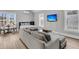 Living space with seating area including a sofa and a mounted television at 3851 Sawyers Island Dr, Mount Pleasant, SC 29466