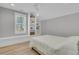 Bright bedroom features a large window, built-in shelves, and light wood floors at 3851 Sawyers Island Dr, Mount Pleasant, SC 29466