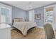 This bedroom features stylish furnishings, light blue walls, and a balcony at 3851 Sawyers Island Dr, Mount Pleasant, SC 29466
