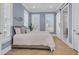 This is a beautifully decorated bedroom with plenty of natural light and a sliding barn door at 3851 Sawyers Island Dr, Mount Pleasant, SC 29466
