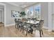 Bright dining area features a rustic table and abundant natural light at 3851 Sawyers Island Dr, Mount Pleasant, SC 29466