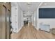 Bright and airy entryway featuring hardwood floors, elegant trim, and a view into a tastefully decorated living space at 3851 Sawyers Island Dr, Mount Pleasant, SC 29466