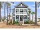 Charming two-story home with a welcoming porch, balcony, and beautifully landscaped front yard at 3851 Sawyers Island Dr, Mount Pleasant, SC 29466