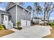 Spacious driveway leading to a two-car garage, surrounded by well-maintained landscaping at 3851 Sawyers Island Dr, Mount Pleasant, SC 29466