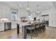 Gourmet kitchen with white cabinets, a large island with seating, and stainless steel appliances at 3851 Sawyers Island Dr, Mount Pleasant, SC 29466