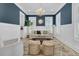 Elegant living room featuring blue accent wall, decorative mirror, and a stunning chandelier at 3851 Sawyers Island Dr, Mount Pleasant, SC 29466