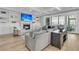 Bright living room with fireplace, shelving and access to a screened-in porch at 3851 Sawyers Island Dr, Mount Pleasant, SC 29466