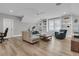 Spacious living room featuring built-in shelves, comfortable seating, and ample natural light at 3851 Sawyers Island Dr, Mount Pleasant, SC 29466