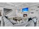 Comfortable living room featuring a fireplace, built-in shelves, and a coffered ceiling at 3851 Sawyers Island Dr, Mount Pleasant, SC 29466