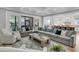 Open concept living area with coffered ceiling, connecting to kitchen and screened porch at 3851 Sawyers Island Dr, Mount Pleasant, SC 29466