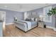 Stylish main bedroom with hardwood floors, plantation shutters and blue walls at 3851 Sawyers Island Dr, Mount Pleasant, SC 29466