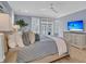 This main bedroom features stylish furnishings, light blue walls, and a ceiling fan at 3851 Sawyers Island Dr, Mount Pleasant, SC 29466