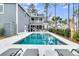 Stunning outdoor oasis featuring a pool, covered patio, and comfortable lounge chairs at 3851 Sawyers Island Dr, Mount Pleasant, SC 29466