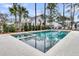 A gorgeous, modern pool with travertine tile, and manicured landscaping at 3851 Sawyers Island Dr, Mount Pleasant, SC 29466