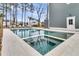 Amazing pool with integrated spa, travertine pavers, and lounge seating at 3851 Sawyers Island Dr, Mount Pleasant, SC 29466