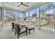 This beautiful screened-in porch with wicker furniture and a ceiling fan at 3851 Sawyers Island Dr, Mount Pleasant, SC 29466