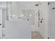 This shower features white tile with a decorative accent, as well as bronze fixtures at 3851 Sawyers Island Dr, Mount Pleasant, SC 29466