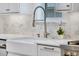 Stylish kitchen features a stainless steel faucet and white farmhouse sink at 3851 Sawyers Island Dr, Mount Pleasant, SC 29466
