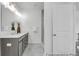 Modern bathroom with double sink vanity, marble floor tiles, and a glass-enclosed shower at 411 Avocet Dr # 554P, Summerville, SC 29486