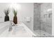 Elegant bathroom featuring a double sink vanity and marble-tiled shower at 411 Avocet Dr # 554P, Summerville, SC 29486