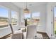 Cozy breakfast nook with natural light, dining table, and views of the backyard at 411 Avocet Dr # 554P, Summerville, SC 29486