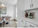 Elegant dining area featuring white cabinets, stylish decor, and ample natural light at 411 Avocet Dr # 554P, Summerville, SC 29486