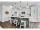 Modern kitchen with white cabinets, an island with seating, and pendant lighting at 411 Avocet Dr # 554P, Summerville, SC 29486