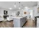 Spacious kitchen with island open to living room and breakfast nook; wood flooring at 411 Avocet Dr # 554P, Summerville, SC 29486