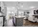 Stylish kitchen featuring an island with seating, open to the dining and living areas at 411 Avocet Dr # 554P, Summerville, SC 29486
