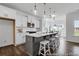 Bright open kitchen with a large island, stainless steel appliances, and hardwood floors at 411 Avocet Dr # 554P, Summerville, SC 29486