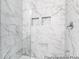 Modern shower featuring marble wall tiles and built-in niches at 411 Avocet Dr # 554P, Summerville, SC 29486