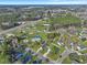 Aerial shot showcases homes with green lawns in a quaint neighborhood near a wooded area and highway at 512 Resinwood Rd, Moncks Corner, SC 29461