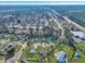 High-angle aerial view features a residential neighborhood with proximity to wooded areas and a highway at 512 Resinwood Rd, Moncks Corner, SC 29461