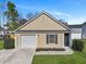 Charming home exterior with a garage and well-maintained lawn at 512 Resinwood Rd, Moncks Corner, SC 29461