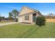 A cozy single-story house featuring a manicured lawn, and a single-car garage at 512 Resinwood Rd, Moncks Corner, SC 29461