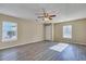 Spacious living room featuring wood flooring and natural light from large windows at 512 Resinwood Rd, Moncks Corner, SC 29461