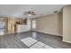 View of the open-concept living room with wood floors, and a kitchen in the background at 512 Resinwood Rd, Moncks Corner, SC 29461
