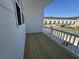 Balcony with white railing overlooking a residential community and pond at 5120 Double Eagle, Summerville, SC 29485
