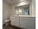 A full bathroom vanity, sink, toilet, and large mirror at 5120 Double Eagle, Summerville, SC 29485